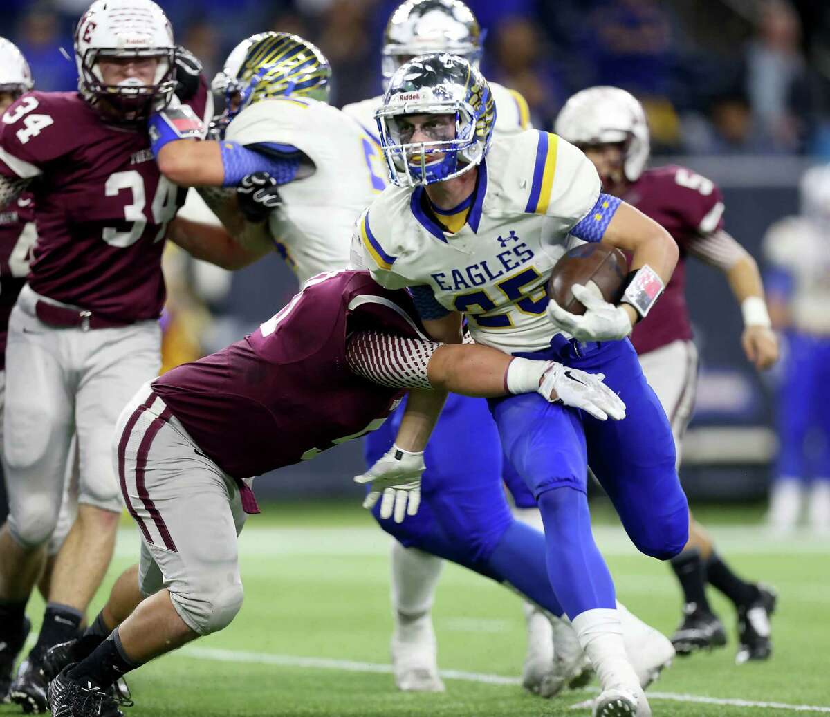 Cameron Yoe's Eddie Luna, left, stops Brock's Leddy French in the first half Thursday night. French ran for 133 yards and three touchdowns.