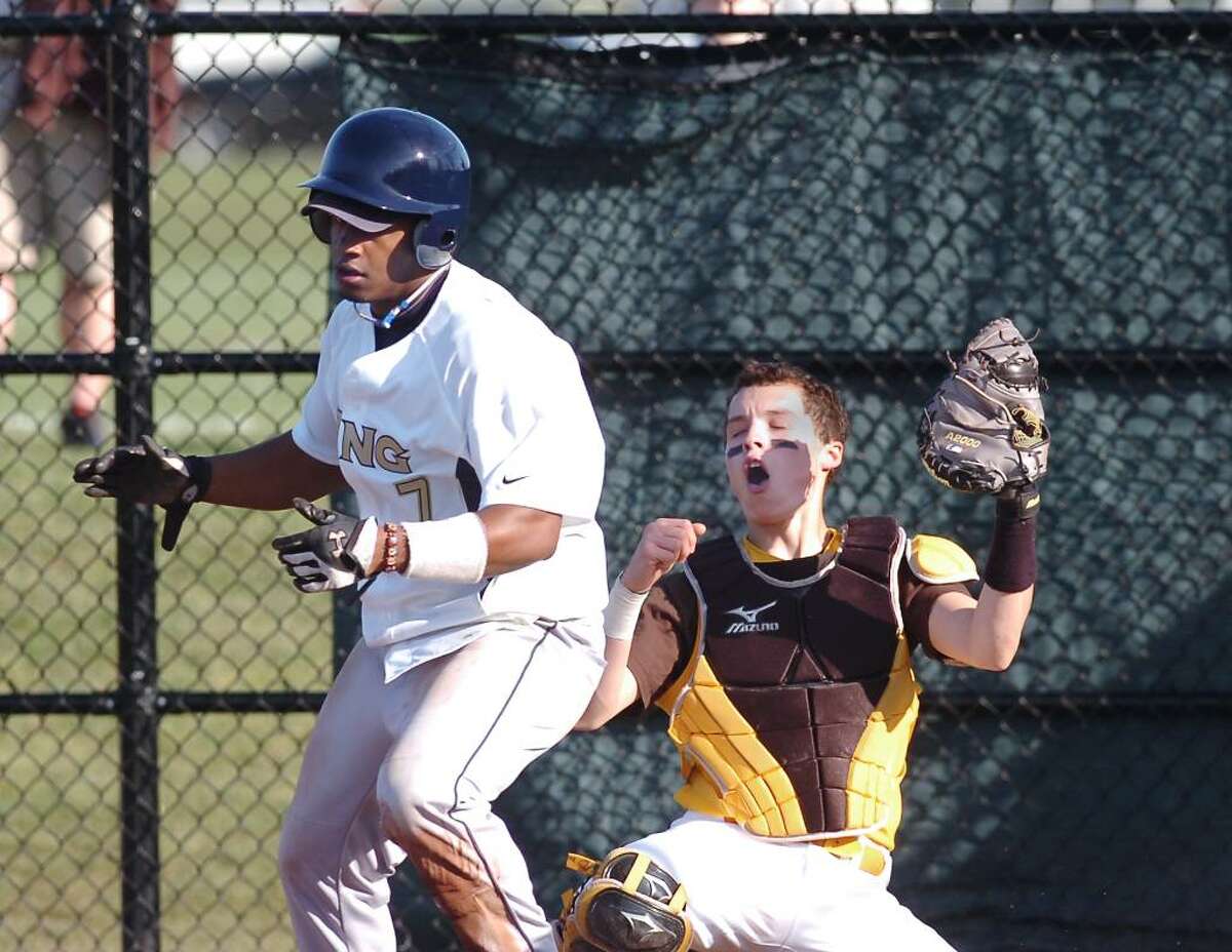 Brunswick catcher, J.P. Bowgen, reacts after King runner Eric Joyner, # 7, left, was called safe at home plate during a play at the plate in the top of the 4th inning, at Brunswick School, Greenwich, Conn., April lst, 2010.