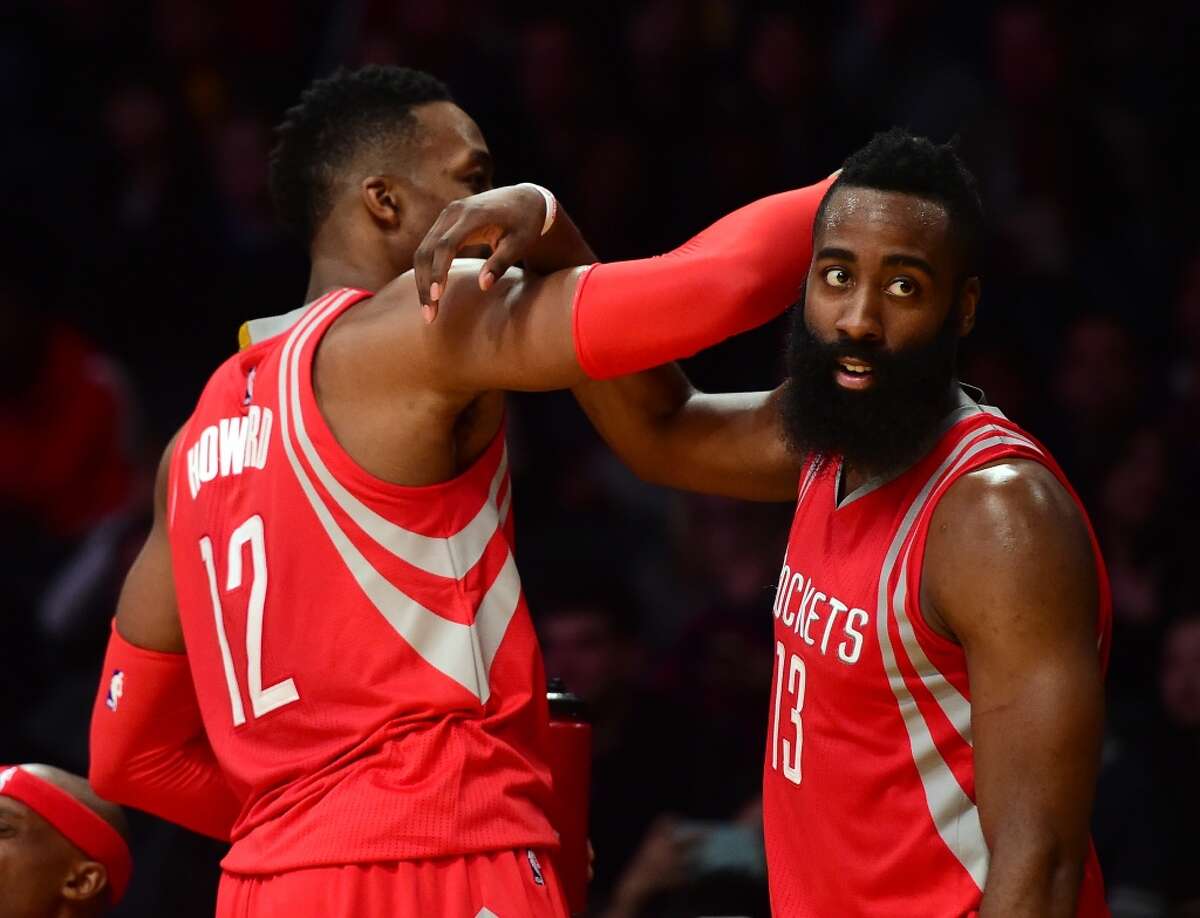 LOS ANGELES, CA - DECEMBER 17: James Harden #13 and Dwight Howard #12 of the Houston Rockets celebrate a 107-87 win over the Los Angeles Lakers at Staples Center on December 17, 2015 in Los Angeles, California. NOTE TO USER: User expressly acknowledges and agrees that, by downloading and or using this Photograph, user is consenting to the terms and condition of the Getty Images License Agreement. (Photo by Harry How/Getty Images)