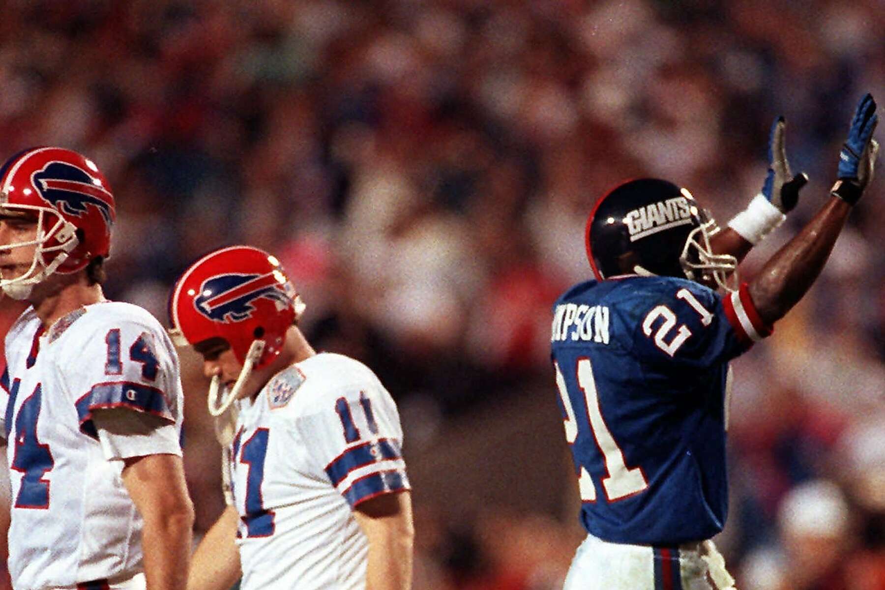 Buffalo Bills kicker Scott Norwood (11) walks off the field after missing a  47-yard field goal on the last play of the game, clinching a 20-19 victory  for the New York Giants