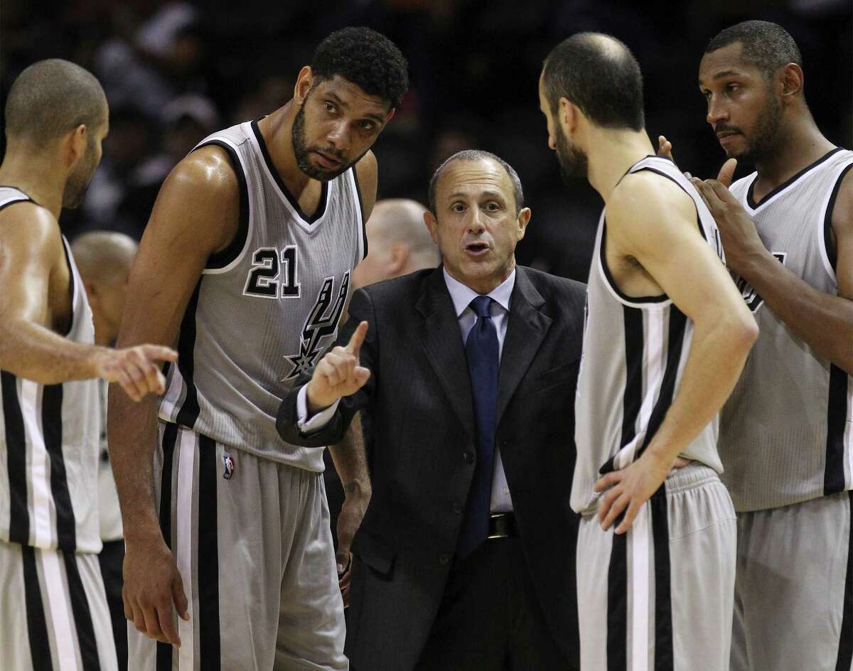 Spurs assistant coach Ettore Messina directs the team during a timeout against the Sacramento Kings at the AT&T Center on Nov. 28, 2014.