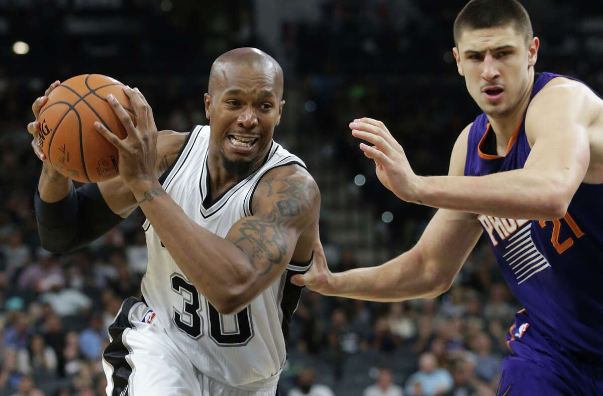 David West looks for room around the basket as the Spurs host the Phoenix Suns in a preseason game at the AT&T Center on Oct. 20, 2015.