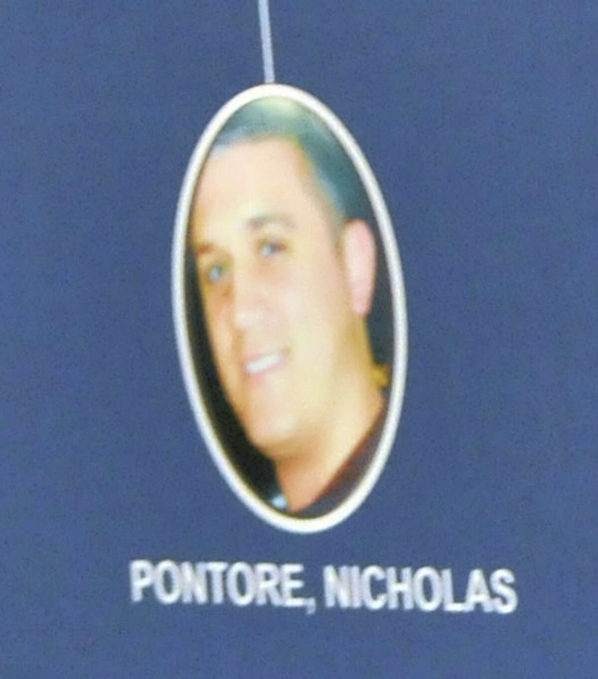 A photo of Nicholas Pontore is displayed during a press conference on Tuesday, Aug. 4, 2015, at The New York State Police Academy in Albany, N.Y. (Phoebe Sheehan/Times Union archive)