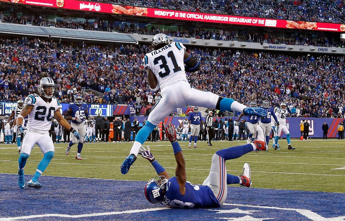 EAST RUTHERFORD, NJ - DECEMBER 20: Charles Tillman #31 of the Carolina Panthers intercepts a ball intended for Hakeem Nicks #88 of the New York Giants in the fourth quarter during their game at MetLife Stadium on December 20, 2015 in East Rutherford, New Jersey. (Photo by Jeff Zelevansky/Getty Images)