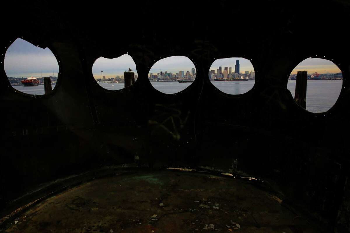 The city is shown through the wheelhouse windows of the historic ferry Kalakala outside of Salty's on Alki. Salty's restaurant owner Gerry Kingen purchased parts of the historic ferry Kalakala after the ship was dismantled. After years of efforts to preserve the ferry, it finally met its end at in Tacoma shipyard. Photographed on Wednesday, Feb. 11, 2015.