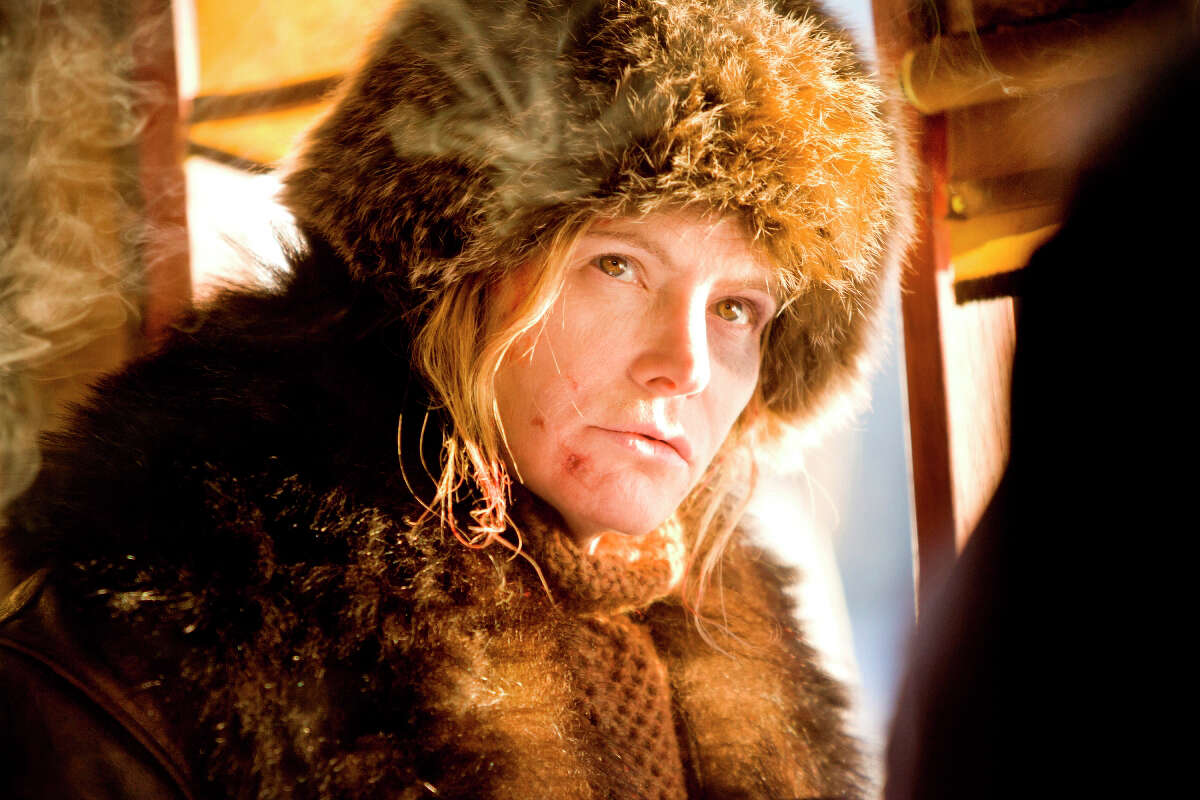 This image released by The Weinstein Company shows Jennifer Jason Leigh in a scene from "The Hateful Eight." Jason Leigh was nominated for a Golden Globe award for best supporting actress for her role in the film on Thursday, Dec. 10, 2015. The 73rd Annual Golden Globes will be held on Jan. 10, 2016.
