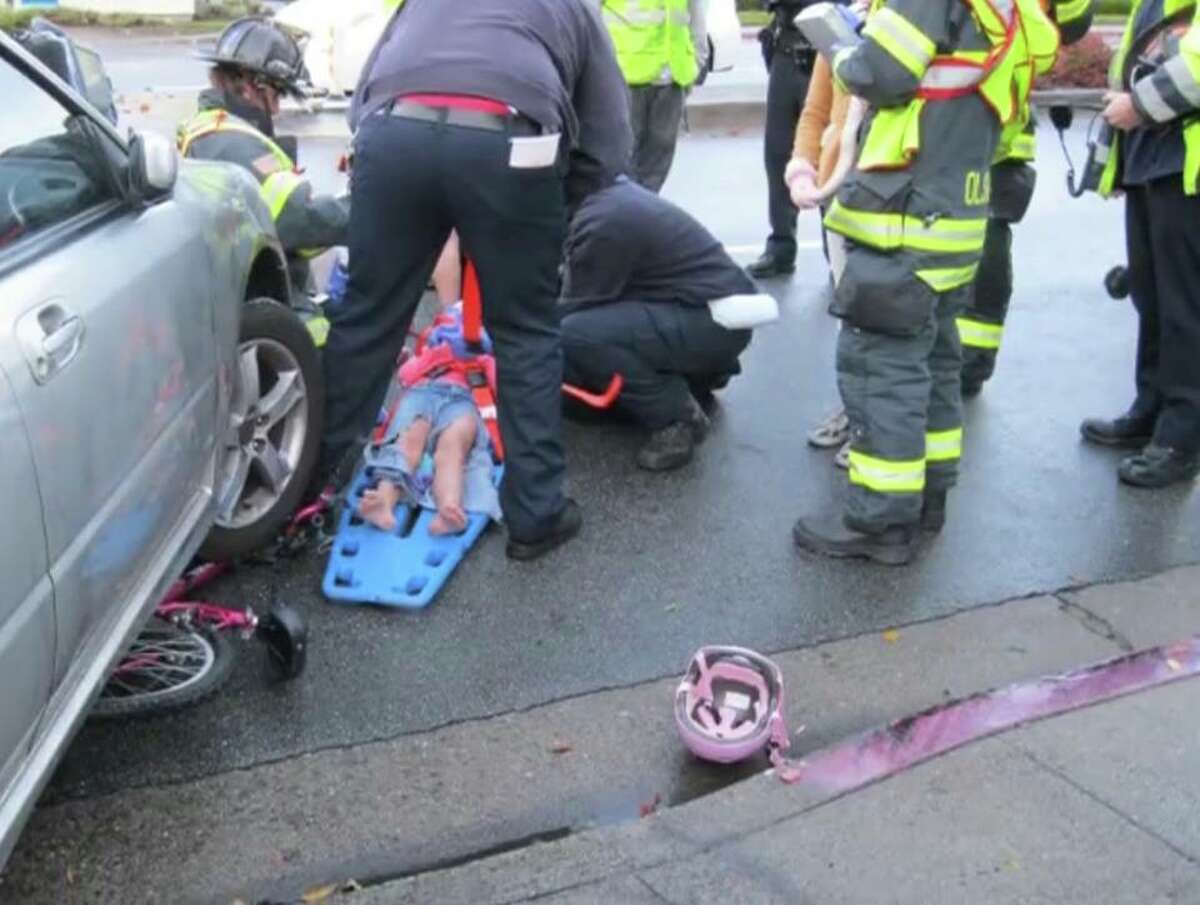 Foster City police presented this crash victim with a replacement bike. 
