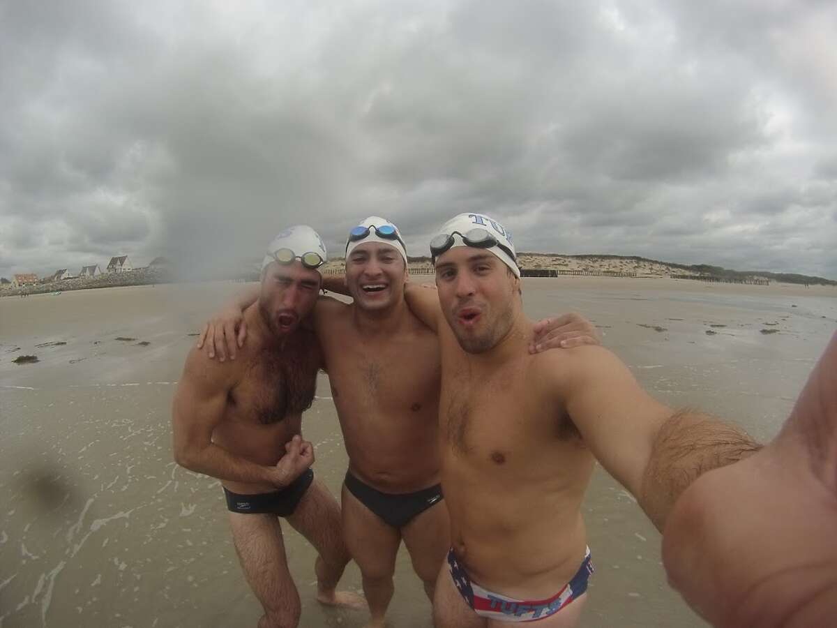 (Left to right) Chris Vorlicek, Andrew Altman and Lou Tamposi on the beach in France after swimming across the English Channel.