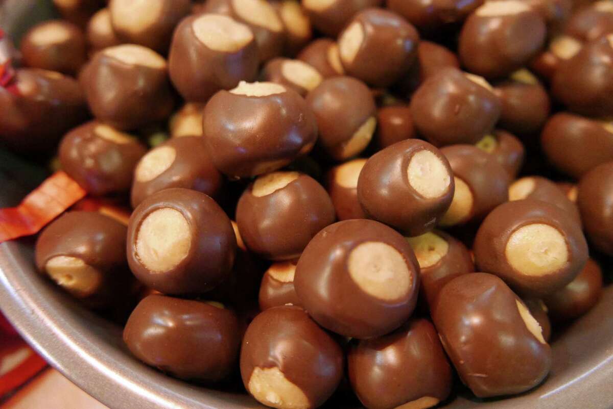 Buckeyes consist of peanut butter balls tips in chocolate to resemble a buckeye nut.