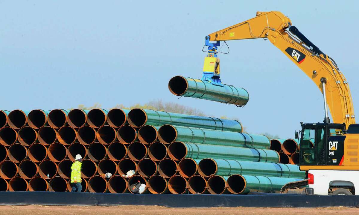 Pipes for the proposed Dakota Access Pipeline are stacked at a staging area in Worthing, S.D. If approved, the pipeline would stretch from the Bakken oil fields in North Dakota through South Dakota and Iowa to a hub in Illinois. The project would move at least 450,000 barrels of crude daily from the Bakken oil patch.