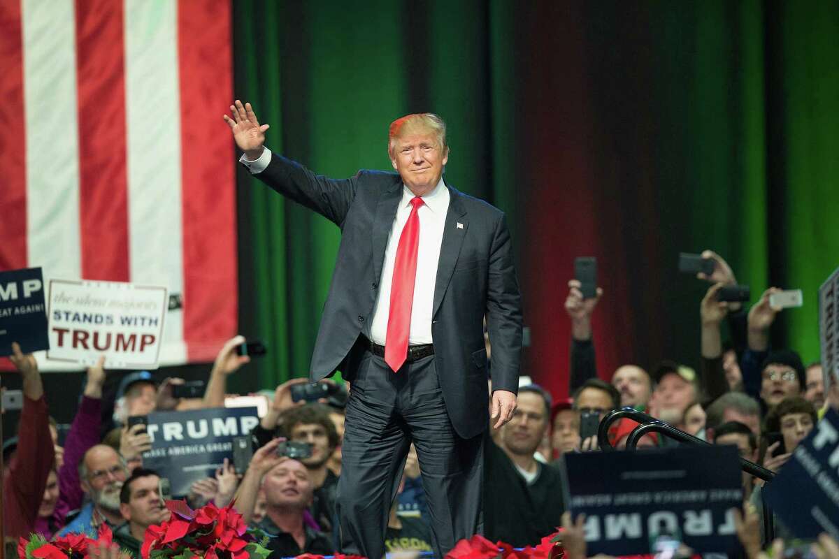 Republican presidential candidate Donald Trump greets guests at a campaign rally on December 21, 2015 in Grand Rapids, Michigan. Fifty percent of American voters say they would be embarrassed to have Trump as president, according to a Quinnipiac University National poll released Tuesday, Dec. 22, 2015.