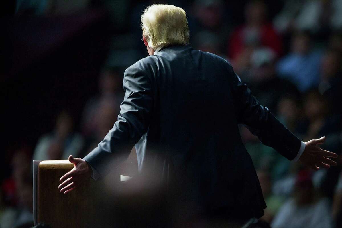 Republican presidential candidate Donald Trump speaks to guests at a campaign rally on December 21, 2015 in Grand Rapids, Michigan. Fifty percent of American voters say they would be embarrassed to have Trump as president, according to a Quinnipiac University National poll released Tuesday, Dec. 22, 2015.