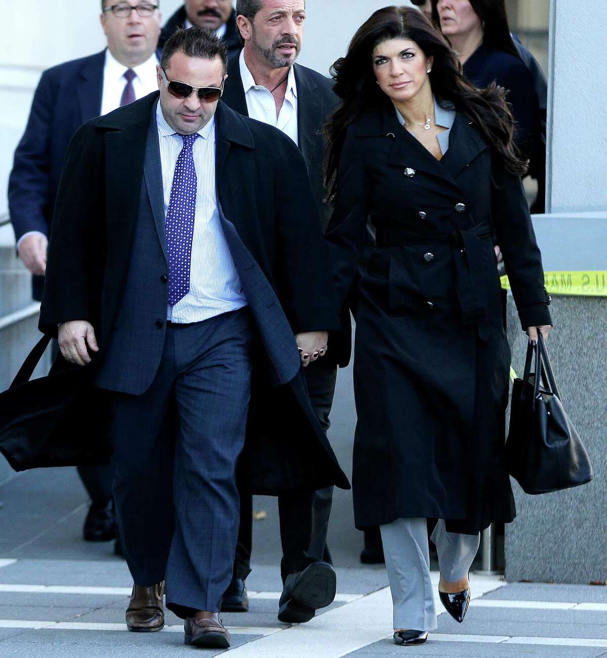 Giuseppe "Joe" Giudice, 43, left, and his wife, Teresa Giudice, 41, of Montville Township, N.J., walk out of Martin Luther King, Jr. Courthouse after a court appearance Nov. 20, 2013, in Newark, N.J.
