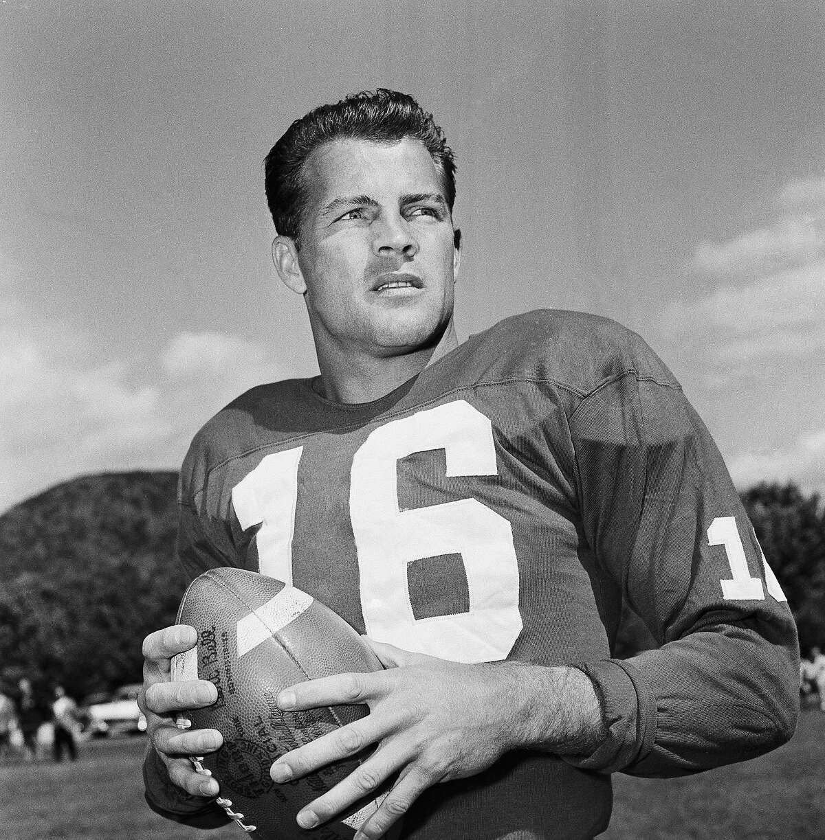 FILE - In this Sept. 9, 1958 file photo, New York Giants halfback Frank Gifford participates in a workout in New York. Gifford, a running back, defensive back, wide receiver and special teams player, played in five NFL title games and was the league's MVP in 1956, died Sunday, Aug. 9, 2015. He was 84. (AP Photo/John Rooney, File)