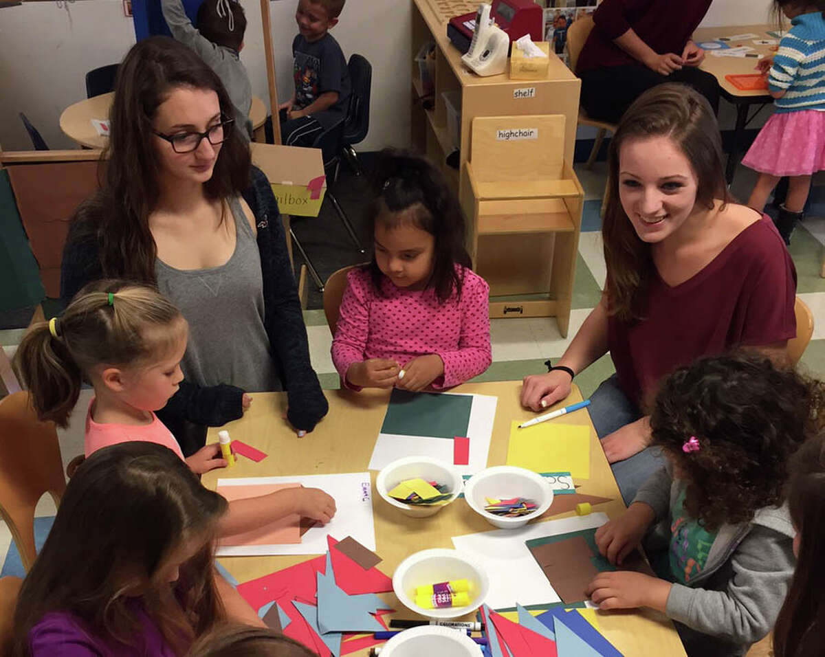The New Milford High School early childhood/child development class recently developed a school to community partnership with Kindercare in town. Above, NMHS students Taylor Val, third from left, and Kailyn Johnson, second from right, interact with Kindercare students, from left to right, Sophia Mikolajczyk, Emma Ganly, Scarlett Jara and Brooke Saraceno, during a recent visit.