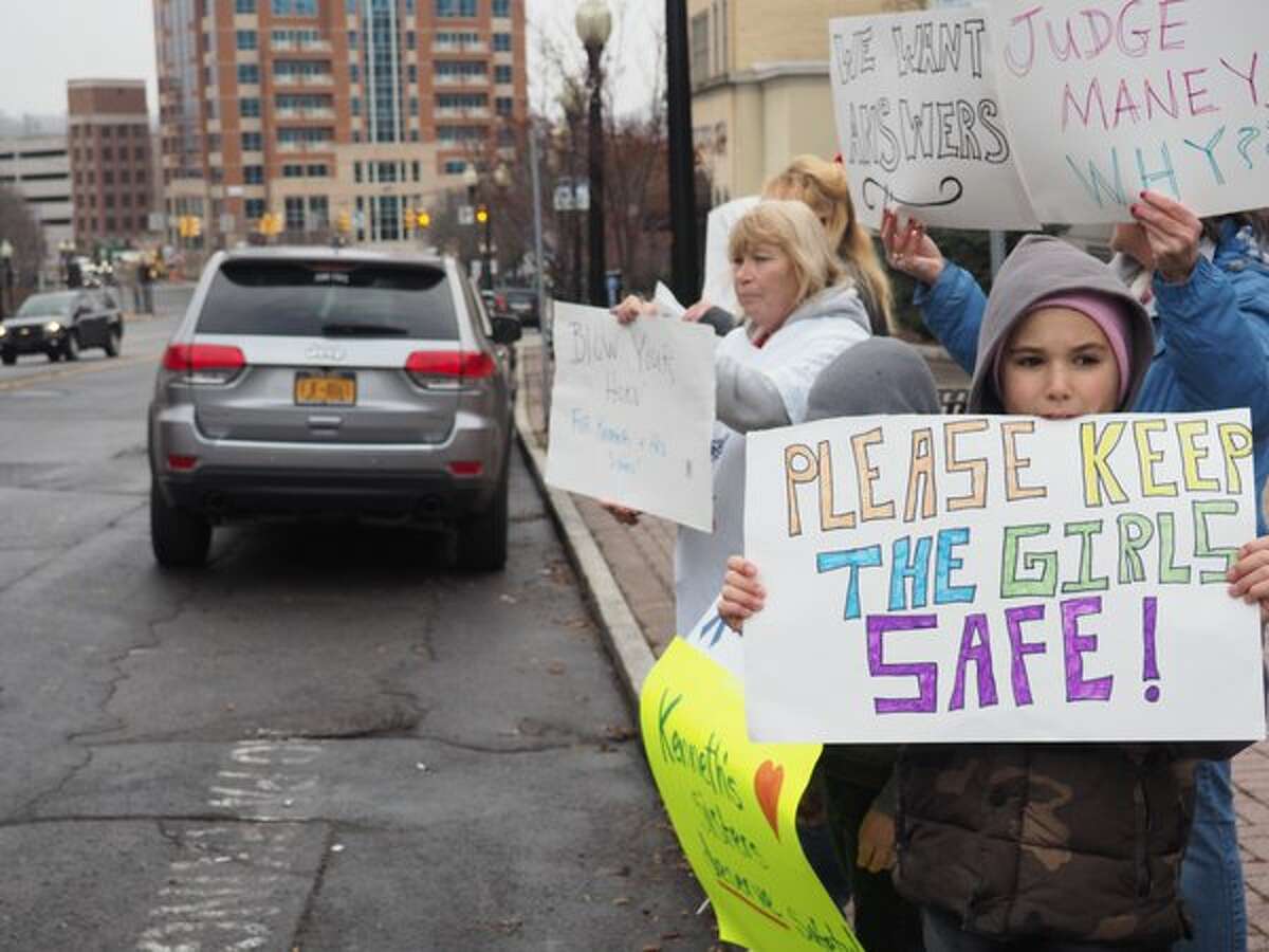 Tyler Rider, 10, of Rensselaer protests with "Kenneth's Army" against decision where to place the siblings of Kenneth White, the 5-year-old boy who was killed by his then 19-year-old cousin, Tiffany VanAlstyne, inside the Knox home they shared with VanAlstyne's mother, and White's two sisters. (J.p. Lawrence / Times Union)