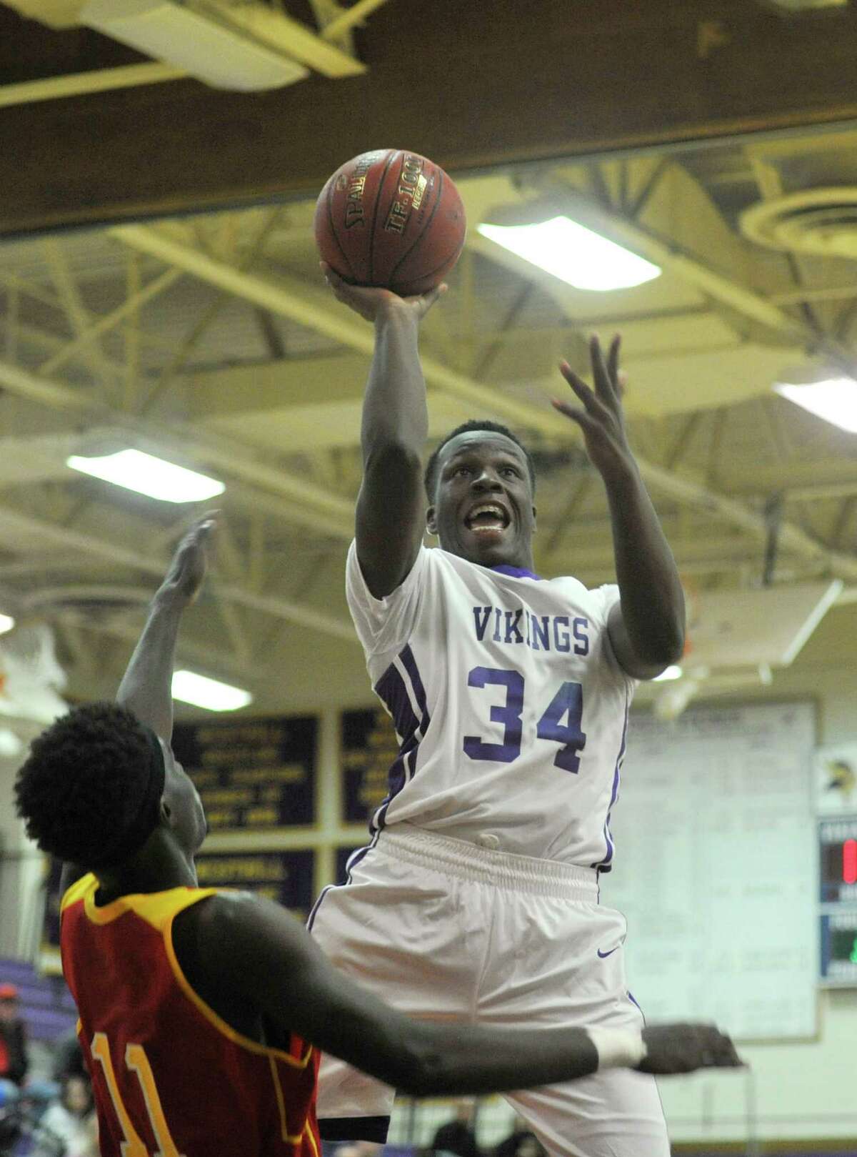 Westhill forward Nathaniel Jefferson hangs in the air before getting up a shot during a regular season game against Stratford at Westhill High School on Wednesday, Dec. 23, 2015.
