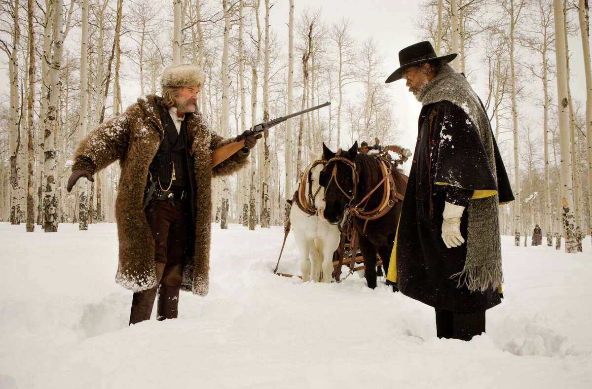 Kurt Russell, left, and Samuel L. Jackson star as bounty hunters in "The Hateful Eight."