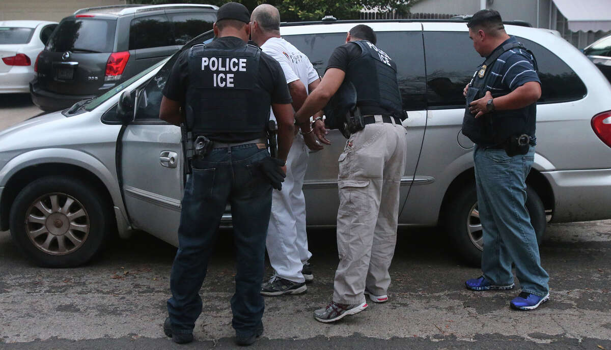 Immigration and Customs Enforcement (ICE) officers arrest a man Monday August 17, 2015 on San Antonio's Northwest Side. The agency was conducting a target enforcement operation to round up immigrants with warrants and outstanding deportation orders.