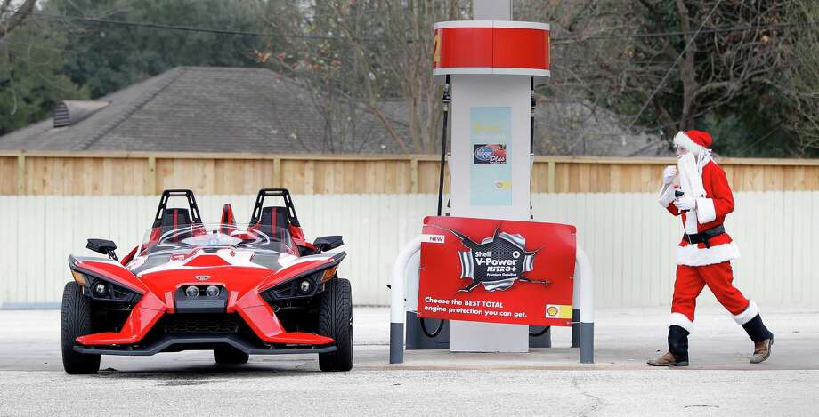 jacob mcneal aka santa walks back to his polaris slingshot sled at a gas station at - Christmas In Houston 2015 jacob mcneal aka santa walks back to his polaris slingshot sled at a gas station at - Christmas In Houston 2015