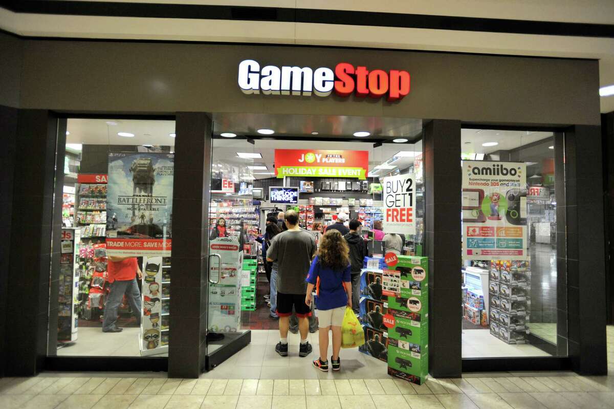 Some stores, like GameStop in the Stamford Town Center, had lines out the door during a last-minute Christmas Eve surge.