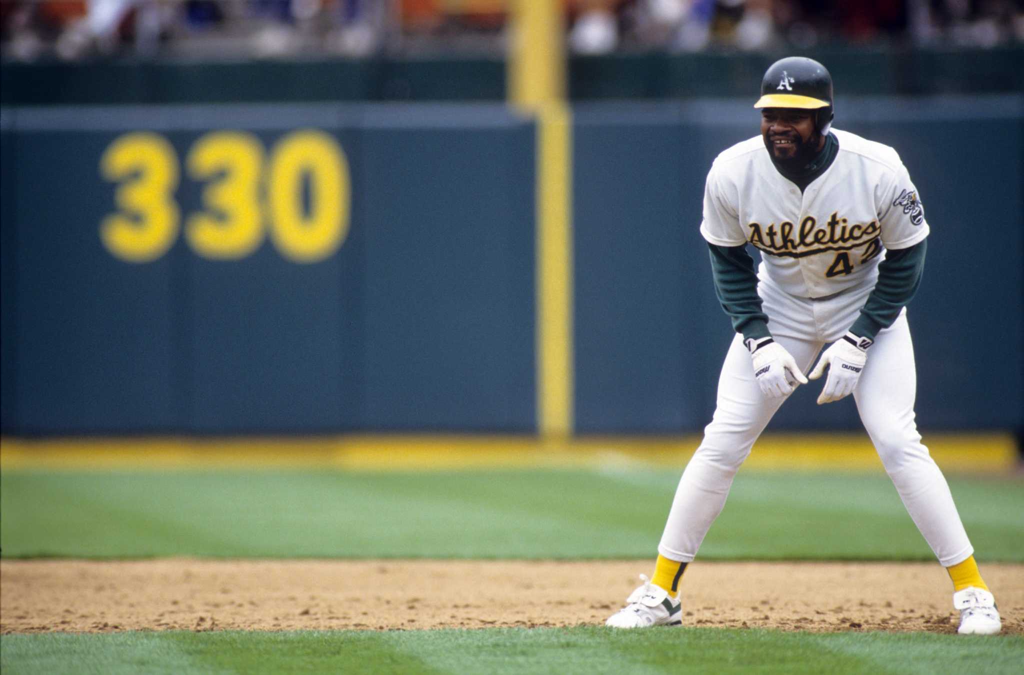 Oakland Athletics - Rickey Henderson poses with Hendu's sons and