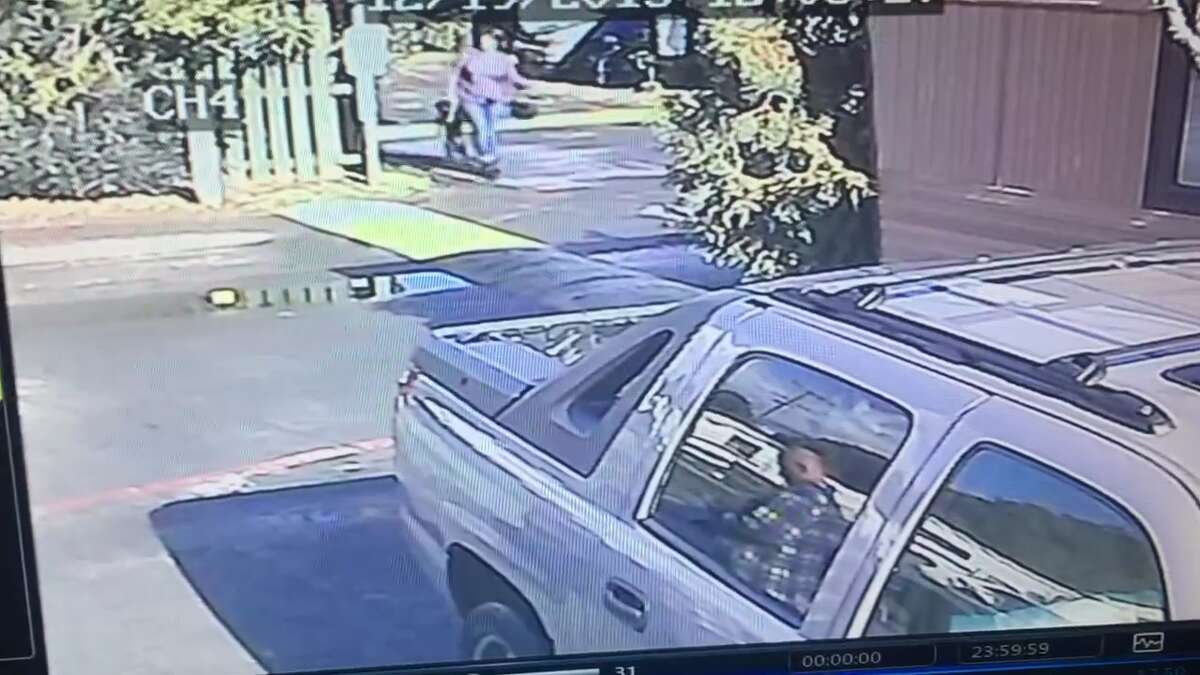 FRAME-BY-FRAME: Surveillance video is shown here zoomed in and converted to still frames to better illustrate the incident of alleged abuse. A woman suspected of abusing a dog is caught on video uploaded to Facebook by David Shields on December 19th, 2015. Fairfield police are investigating the incident and looking for the woman.