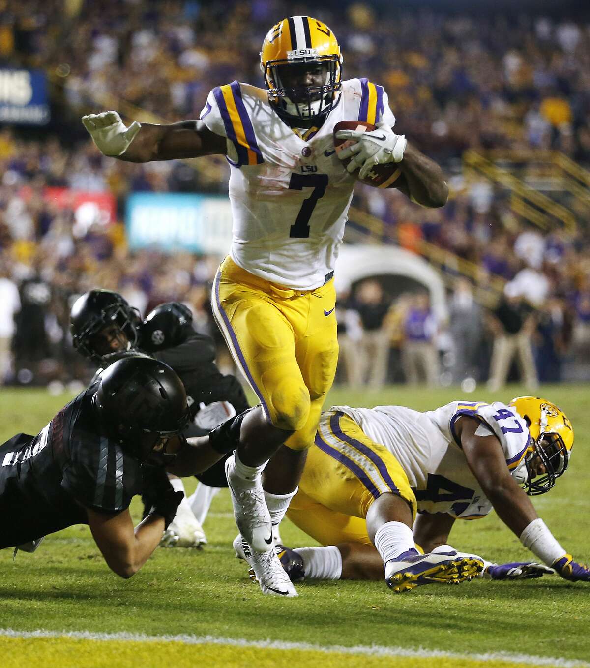 FILE - In this Saturday, Nov. 28, 2015, file photo, LSU running back Leonard Fournette (7) scores a touchdown during the second half of an NCAA college football game against Texas A&M in Baton Rouge, La. Fournette has been named to the AP All-America football team. (AP Photo/Jonathan Bachman, File)