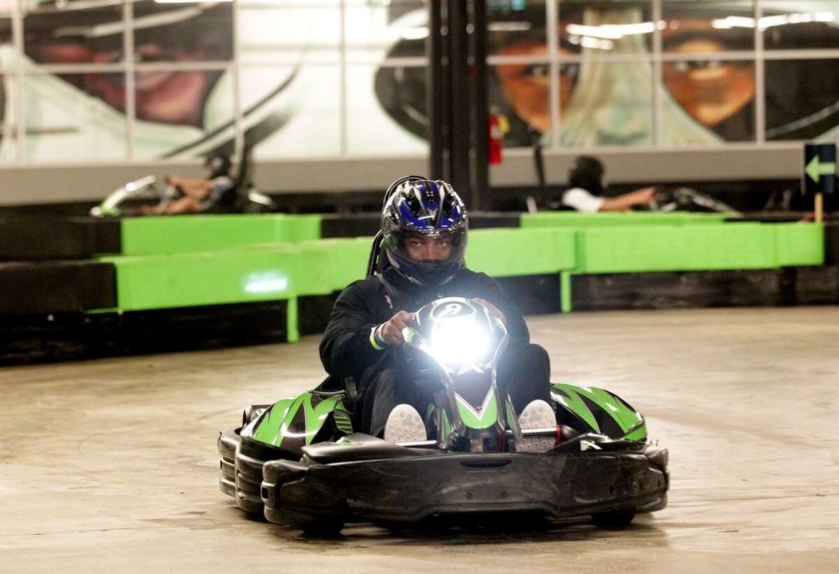 Members of University of Houston's football team race go carts at Andretti Indoor Karting and Games Monday, Dec. 28, 2015, in Marietta. ( Elizabeth Conley / Houston Chronicle )