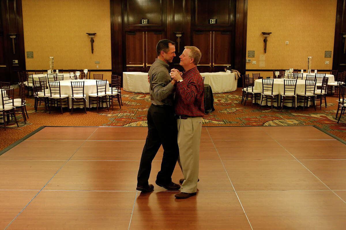 Mark Pharris, right, and Vic Holmes practice their first dance, which they learned over the course of several months at Arthur Murray Dance Studio, the night before their wedding in the ballroom of The Westin Stonebriar in Frisco on Friday, Nov. 11, 2015.