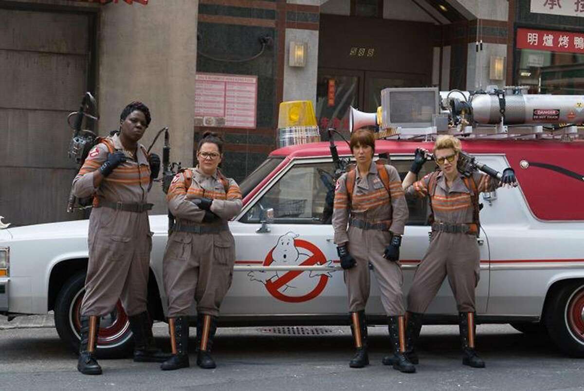 Leslie Jones, Melissa McCarthy, Kristen Wiig and Kate McKinnon in "Ghostbusters" with the "new" Ecto-1.