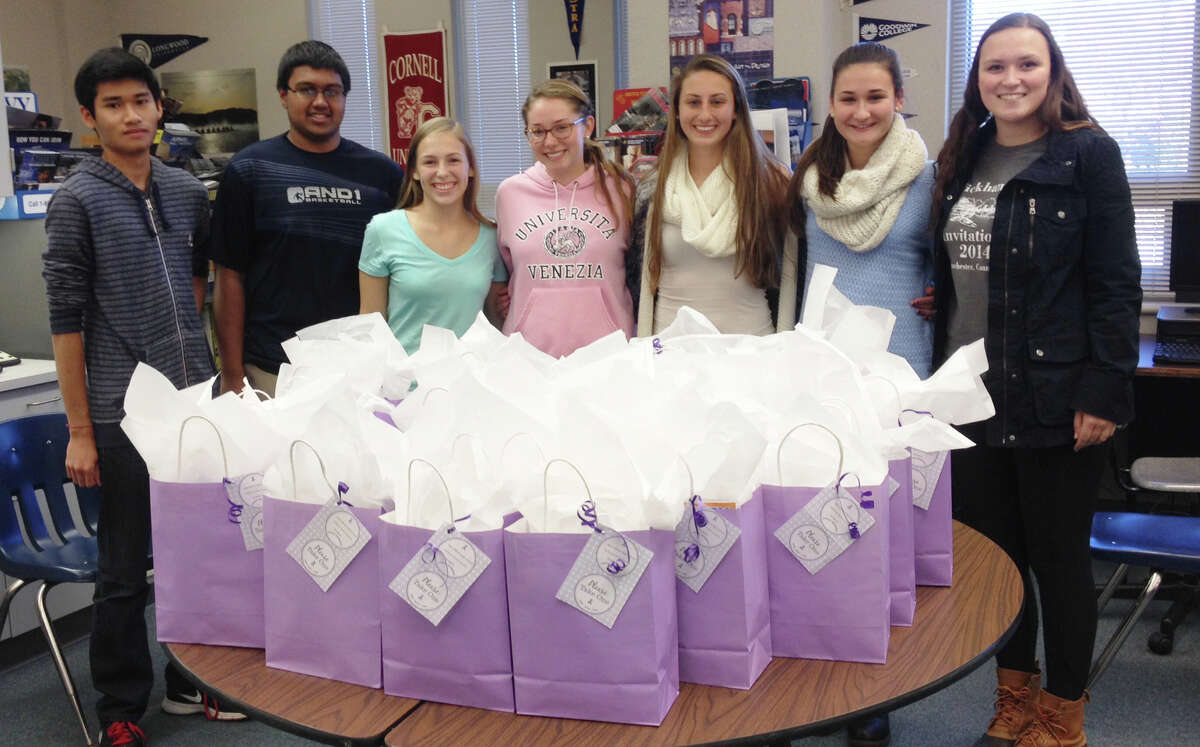 The New Milford High School National Honor Society recently put together 25 chemo care bags for patients of the Diebold Cancer Center at New Milford Hospital. Bottles of water, puzzle books, hand lotion, lip balm and fleece hats sewn by former NMHS teachers Kris Kaczka and Chalice Racey were included in the bags. Above, students, from left to right, Eric Pongsamorn, Aakash Parikh, Caitlyn Cushman, Karli Golembeski, Monica Baxter, Marina Prontelli and chairwoman Allegra Peery, show the completed bags.