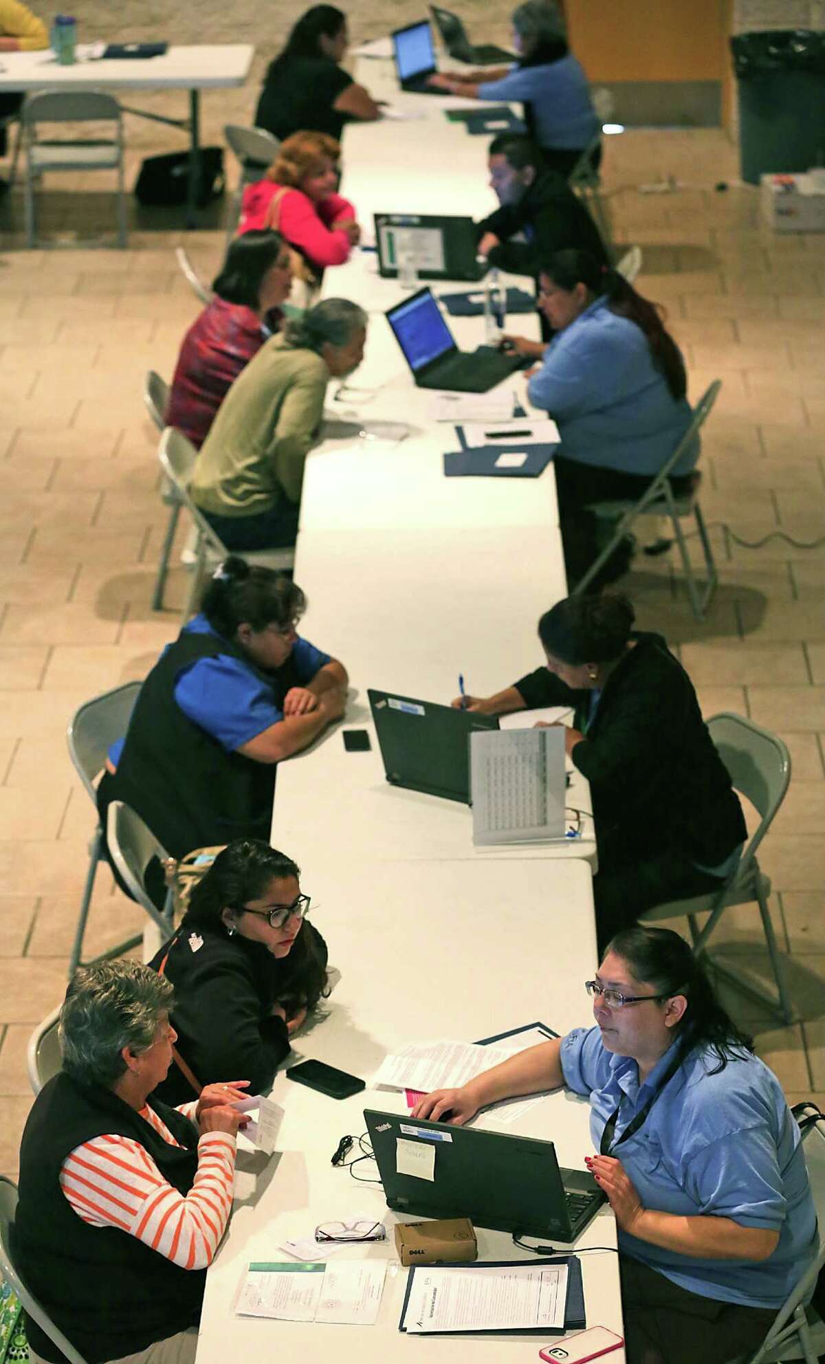 Assistors (right) help individuals enrolling in the 2016 health insurance plans through the Affordable Care Act, at Progreso Hall last month. In San Antonio, 101,863 people had signed up for 2016 health insurance plans on the federal exchange as of Jan. 9, according to the latest enrollment data released by the federal Centers for Medicare and Medicaid Services.
