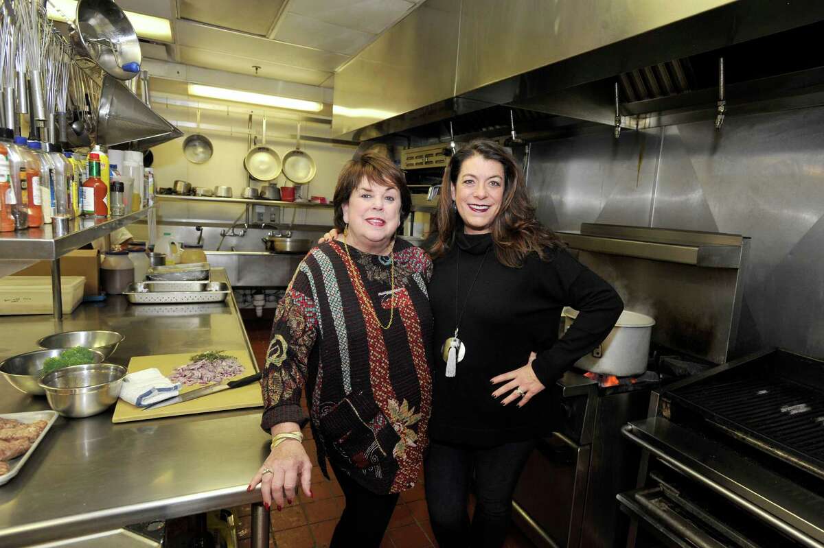 Owner Marcia Selden, left, and her daughter Robin Selden, managing partner and executive chef, pose in the kitchen of Marcia Selden Catering & Event Planning after Marcia was named the first ever inductee to the Connecticut Restaurant Association Hall of Fame.