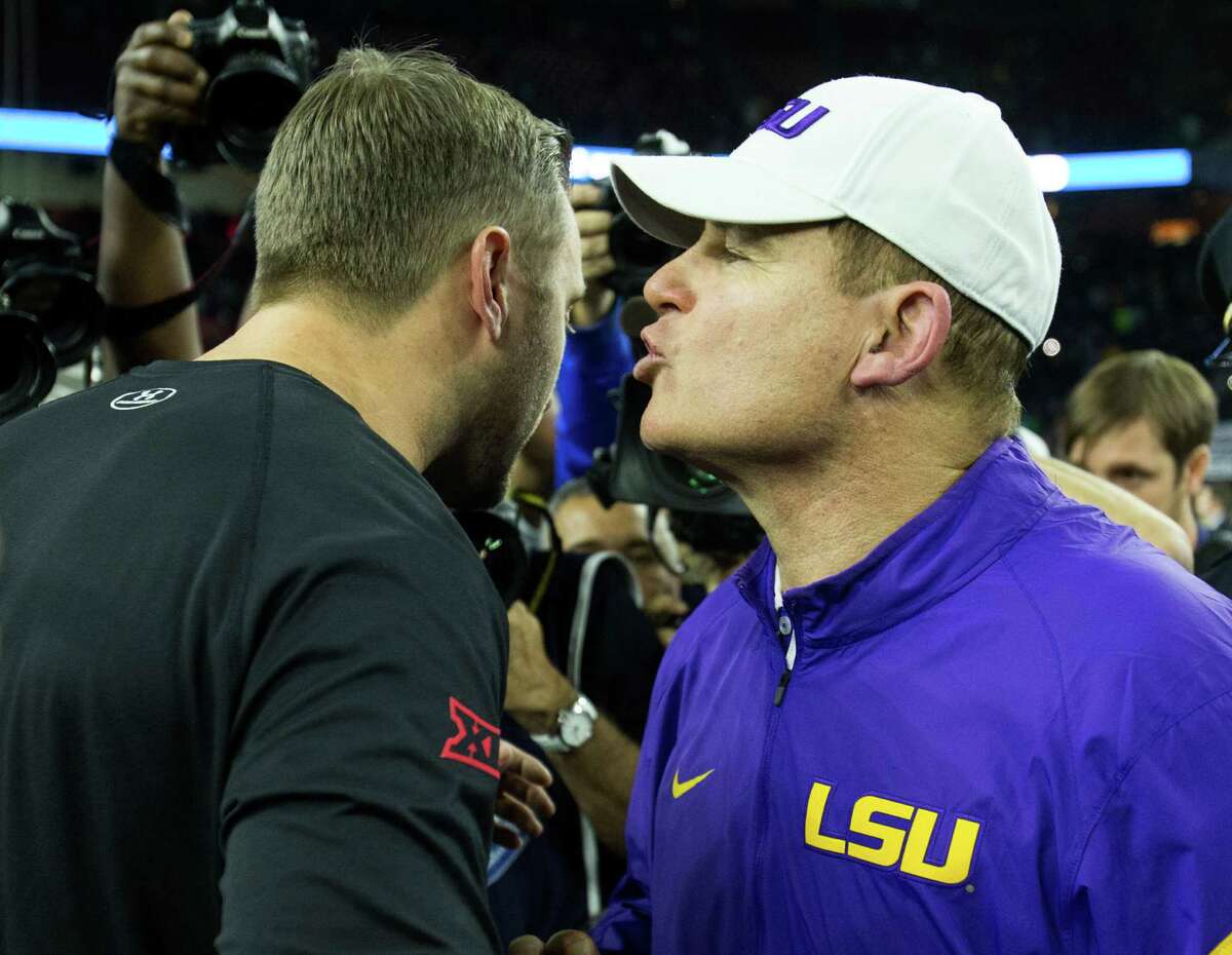 Texas Tech head coach Kliff Kingsbury, left, and LSU head coach Les Miles shake hands after LSU's 56-27 win in the AdvoCare V100 Texas Bowl at NRG Stadium on Tuesday, Dec. 29, 2015, in Houston.