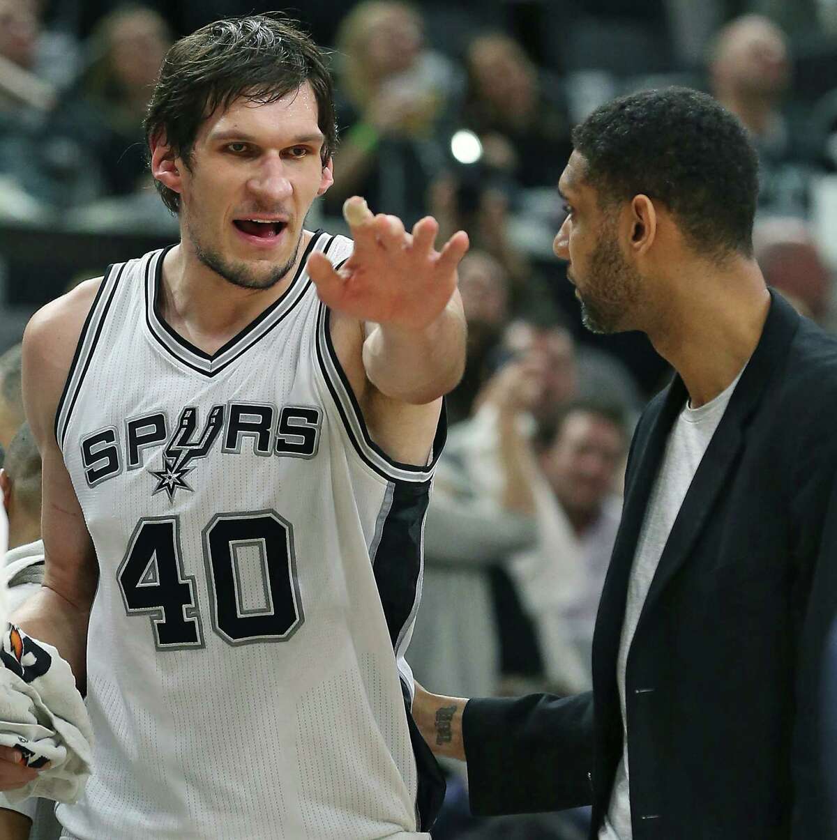 Boban Majanovic has a discussion about play with Tim Duncan on the bench as the Spurs host the Suns at the AT&T Center on December 30, 2015.