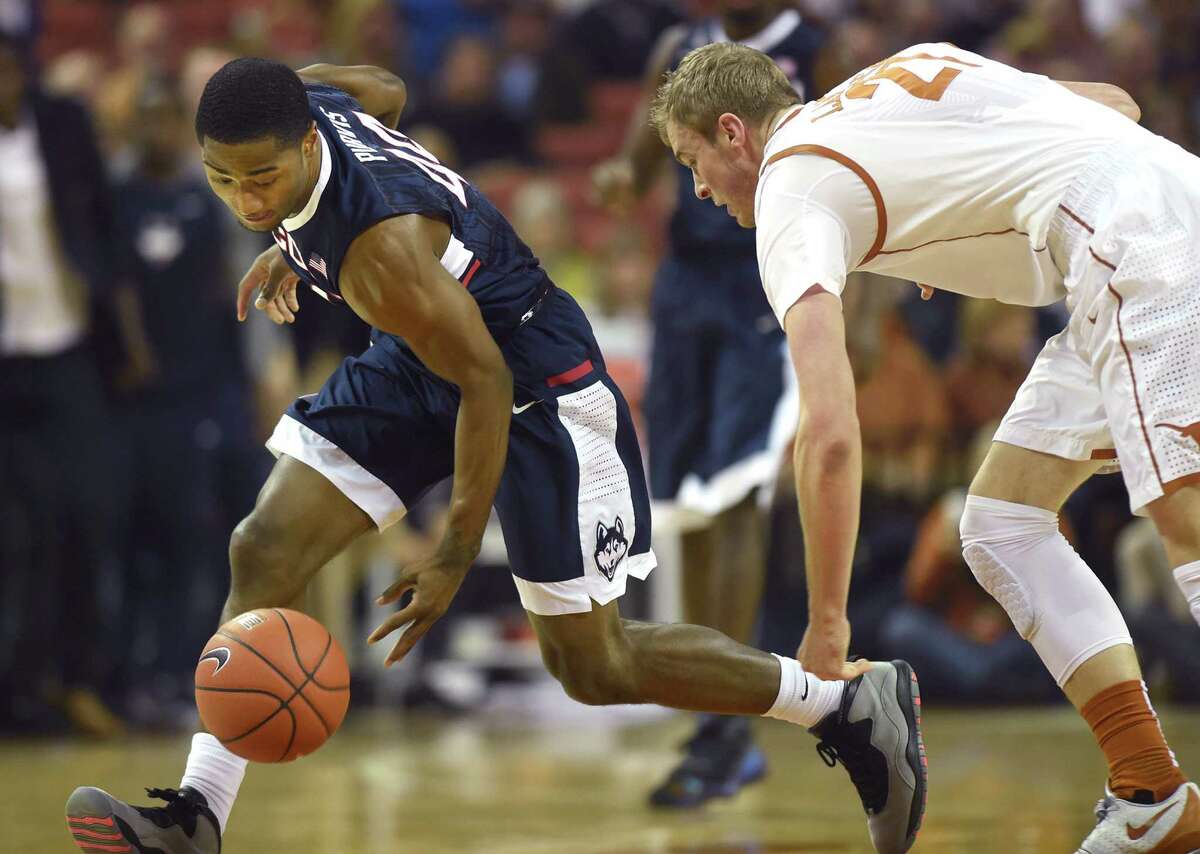 Connecticut Huskies guard Rodney Purvis (44) scoops up a steal in front of Texas Longhorns forward Connor Lammert (21) on Tuesday, Dec. 29, 2015, at the Frank Erwin Center in Austin, Texas. (Brad Horrigan/Hartford Courant/TNS)