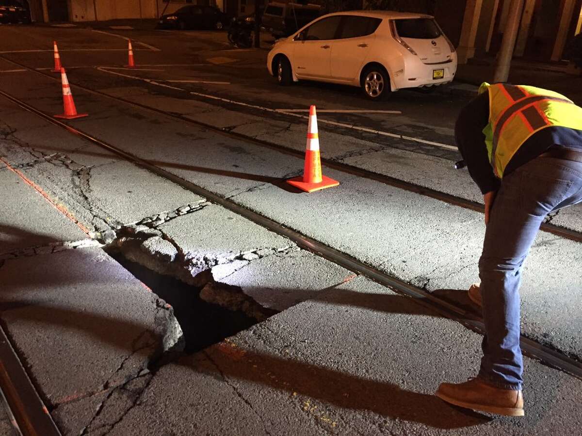 A sinkhole that opened up early Thursday near 24th and Church streets in San Francisco stopped the J-Church Muni line in both directions.