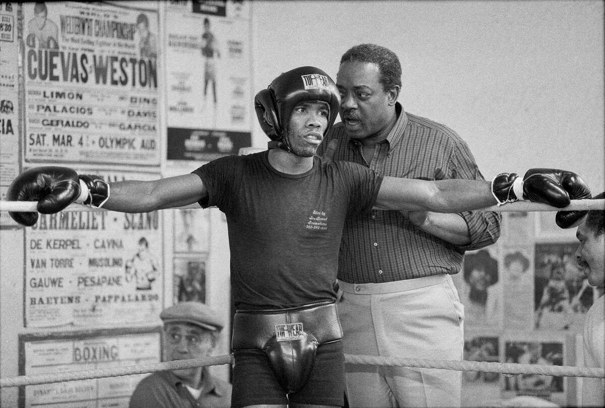 FILE ?— Howard Davis Jr. with Jimmy Glenn, his trainer, at the Times Square boxing gym in New York, April 12, 1982. Davis, a boxer from Long Island who won a gold medal in the 1976 Olympics and the Val Barker trophy, awarded to the most outstanding Olympic fighter, over teammates and fellow gold medalists Michael and Leon Spinks and Sugar Ray Leonard, died on Wednesday, Dec. 30, 2015. He was 59. (Fred R. Conrad/The New York Times) ORG XMIT: XNYT111
