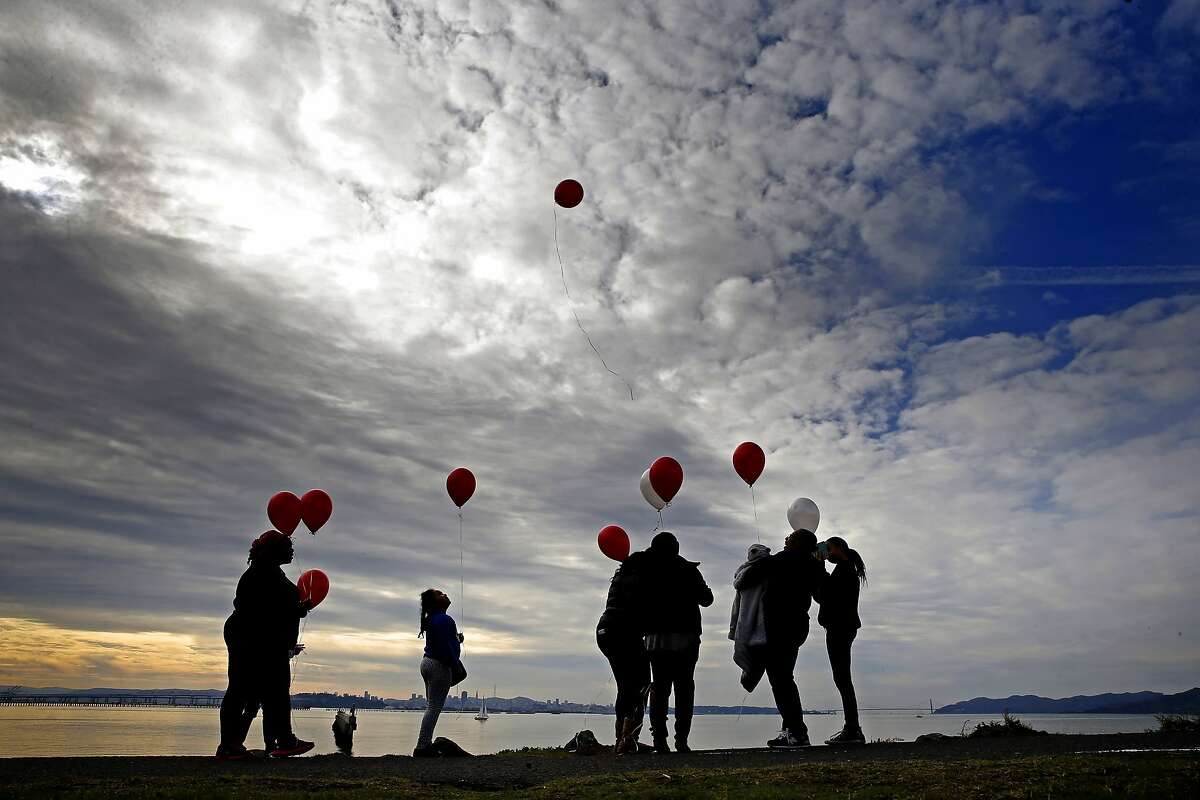 The Aaron family of Berkeley release their balloons into the skies above Cesar Chavez Park along the edge of San Francisco Bay in Berkeley, Calif. on Sat. January 2, 2016, in remembrance of their grandmother who passed away three years ago.