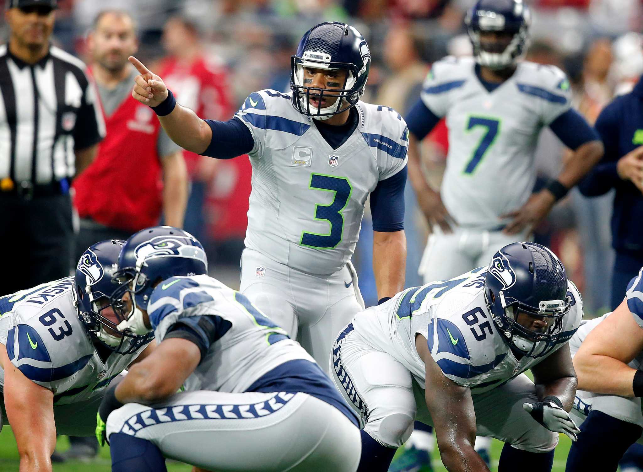 Seattle Seahawks strong safety Kam Chancellor (31)(R) celebrates his  interception with free safety Earl Thomas (29) with cornerback Richard  Sherman (25) and outside linebacker K.J. Wright (50) near by during the  first