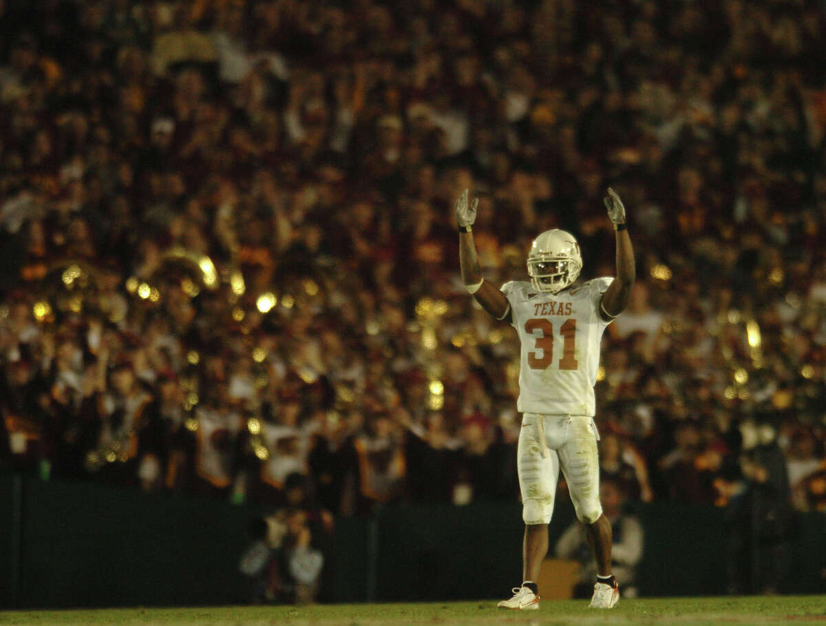Texas Longhorns cornerback Aaron Ross asks for crowd support during Rose Bowl action against USC in the Rose Bowl on Jan. 4, 2006. BILLY CALZADA / STAFF BCS NATIONAL CHAMPIONSHIP SOUTHERN CALIFORNIA TROJANS TEXAS LONGHORNS