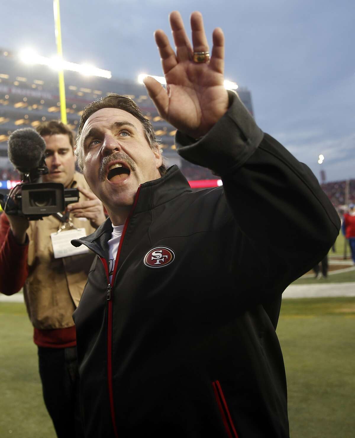 San Francisco 49ers' head coach Jim Tomsula waves to the crowd after Niners' 19-16 win in overtime over St. Louis Rams in NFL game at Levi's Stadium in Santa Clara, Calif., on Sunday, January 3, 2016.