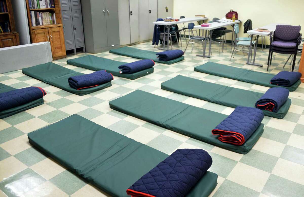 A classroom at Capital City Rescue Mission is converted to temporary sleeping quarters for tonight's code blue Friday Nov. 28, 2014, in Albany, NY. Code Blue is a walk-in, emergency homeless shelter that offers a hot meal and a warm and safe place to sleep when temperatures are below 20 degrees or there is significant snowfall. (John Carl D'Annibale / Times Union)