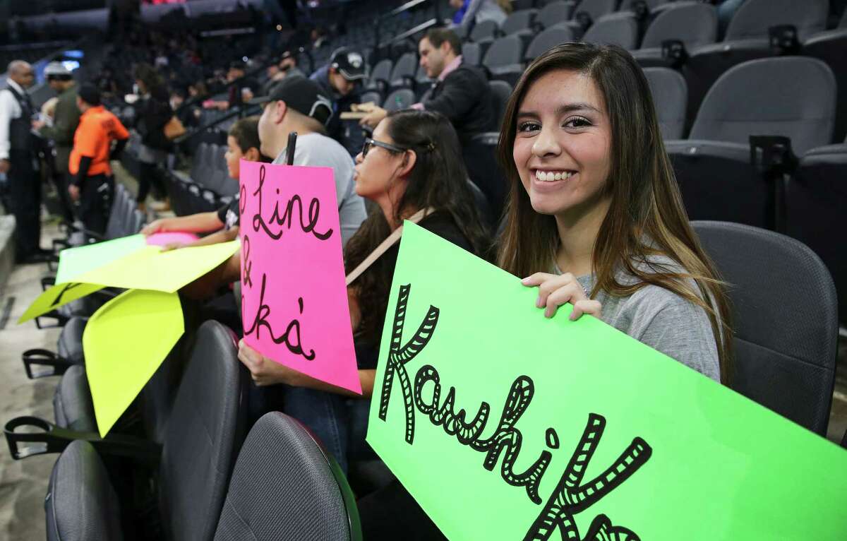 Marissa Rivera readies her Kawhi sign before the game as the Spurs host the Minnesota Timberwolves at the AT&T Center on December 28, 2015.
