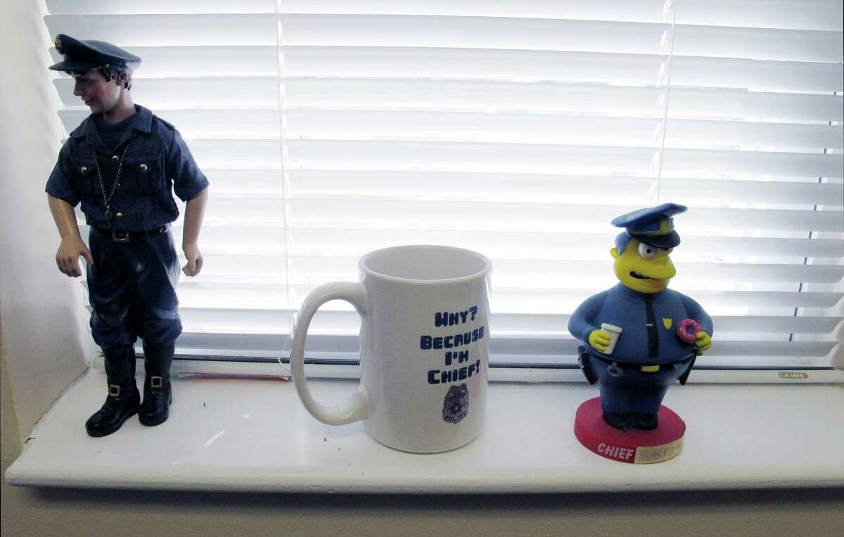 In this Dec. 11, 2015 photo, keepsakes sit on a window sill in the office of Newtown Police Chief Michael Kehoe in Newtown, Conn. Kehoe is retiring Jan. 6, 2016, after 37 years with the town police department. He will be best remembered for leading the response to the Sandy Hook Elementary School shooting on Dec. 14, 2012, that killed 20 children and six educators. (AP Photo/Dave Collins)