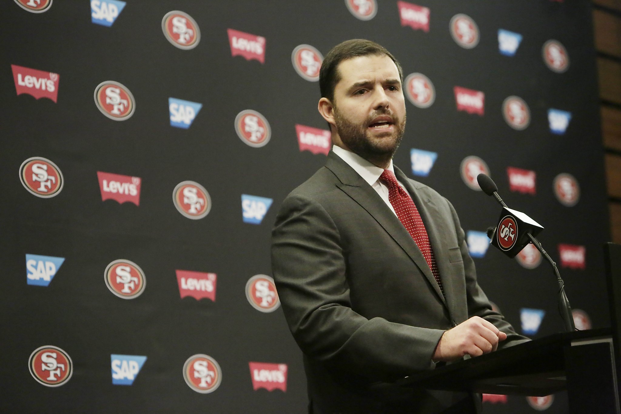 Owner Jed York of the San Francisco 49ers stands on the field