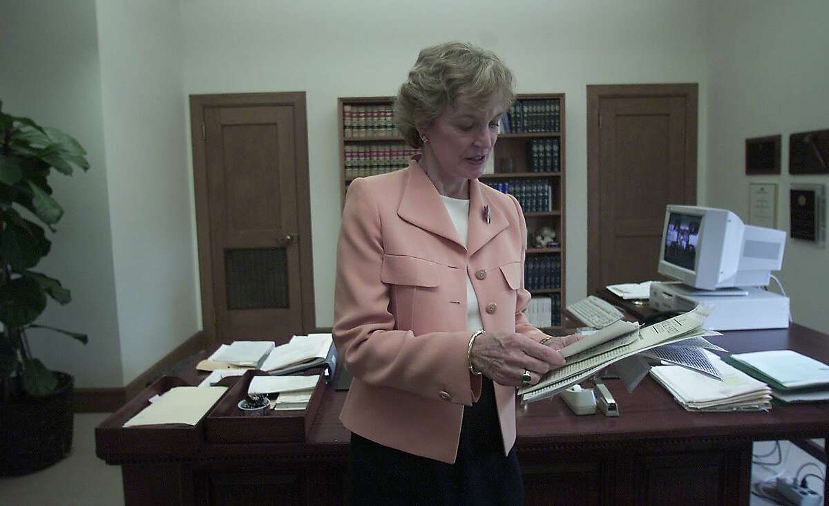 UNCORRECTED COLOR/PLEASE ADJUST WERDEGAR1-C-14AUG02-MT-LS ----Justice Kathryn Mickle Werdegar looks over some notes at ther office in the California Supreme court at 350 McAllister, San Francisco. When Governor Pete Wilson appointed his old law school chum Kathryn Mickle Werdegar to the California Supreme Court she was expected to ease in the classic California Republican role a moderate conservative. But eight years later, she's emerged as one of the most powerful women in California law, a formidable voice for the average citizens. She's written decisions defending the rights of workers, patients, tenants, crime victims, and the disabled. Although she has the image of the scholar groomed in the ivory tower, she has an undeniable compassion for the common soul, shaped by her own painful childhood and her experiences as a woman lawyer unable to get a job. PHOTO BY LEA SUZUKI/SAN FRANCISCO CHRONICLE