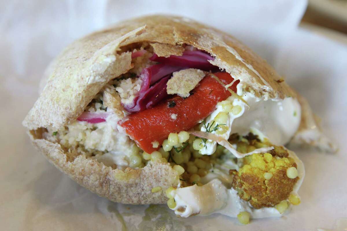 A falafel pita from Andrew Weissman's new venture, Moshe's Golden Falafel at 3910 McCullough Ave. is seen Wednesday July 8, 2015.