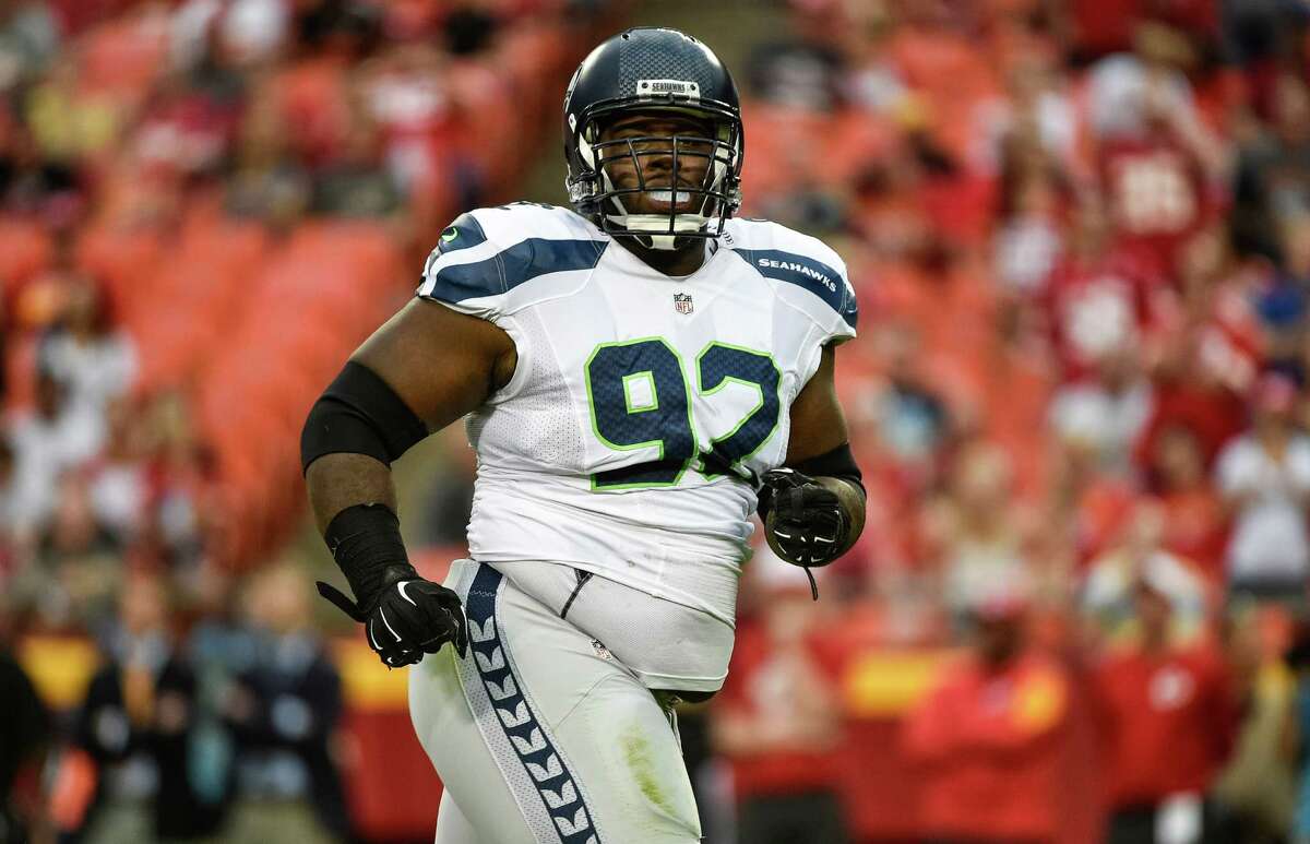 Seattle Seahawks defensive tackle Brandon Mebane celebrates a sack during the first half of an NFL football game on Friday, Aug. 21, 2015, in Kansas City, Mo.